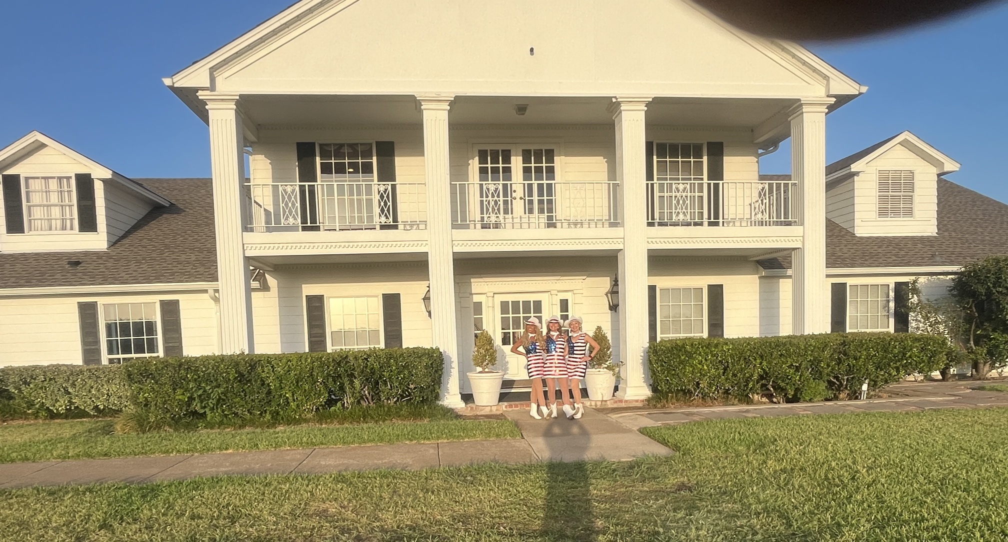 Sassafras dancers in front of the Southfork Ranch mansion