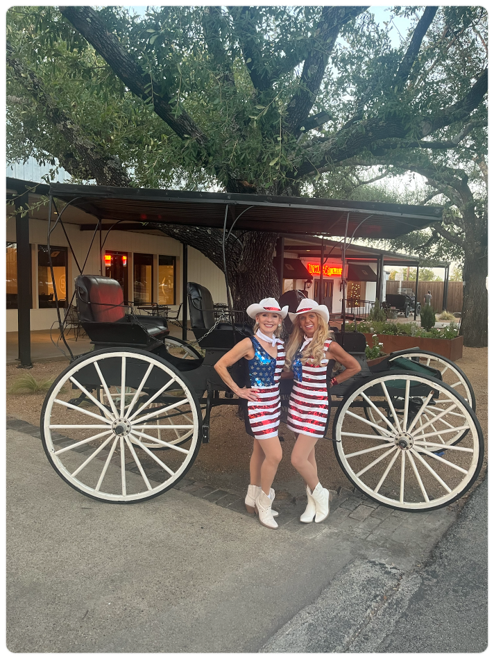 Sassafras dancers posing by a carriage at Southfork Ranch